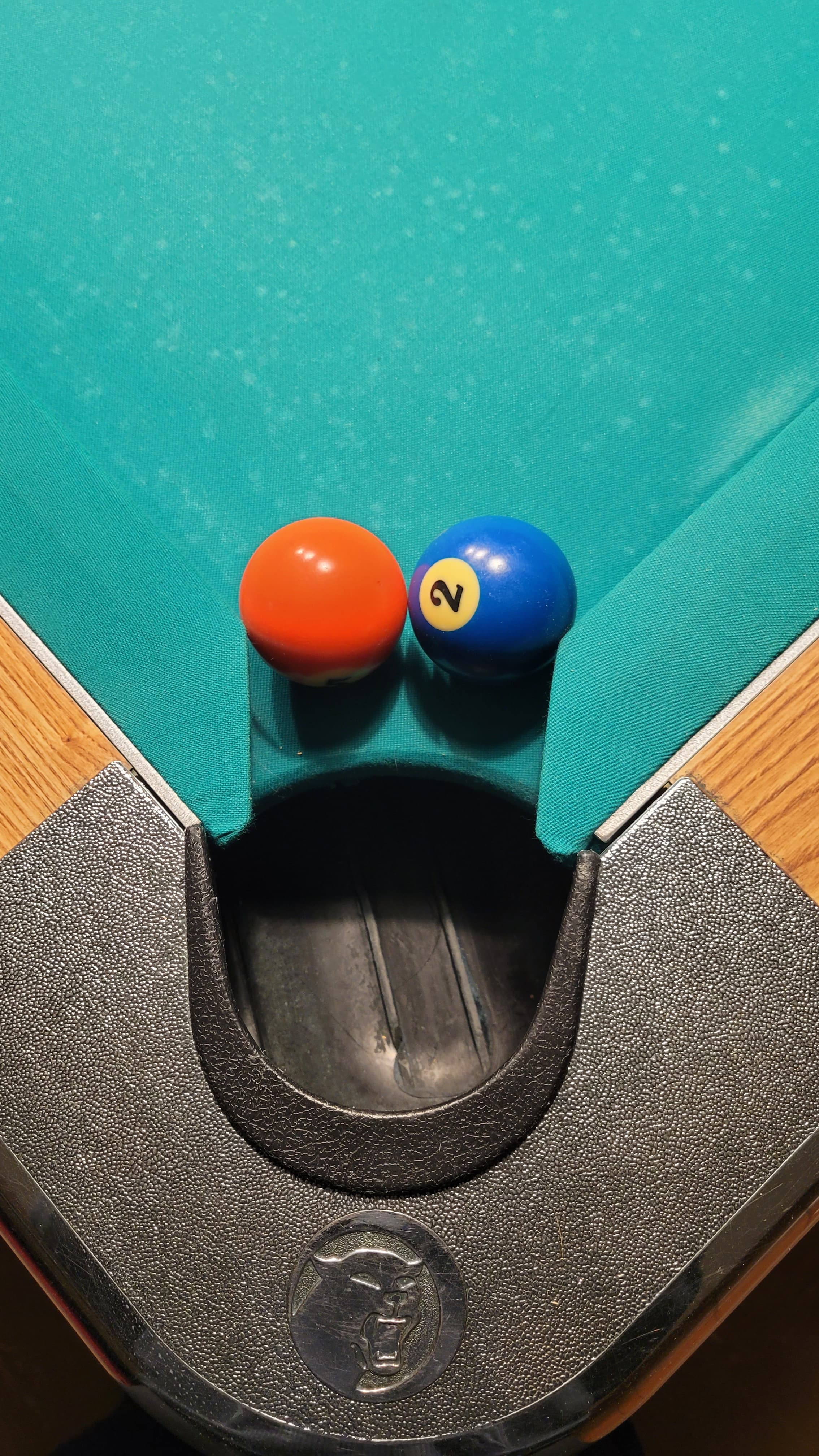Tight pocket demonstration - balls at pocket edge showing reduced pocket size
